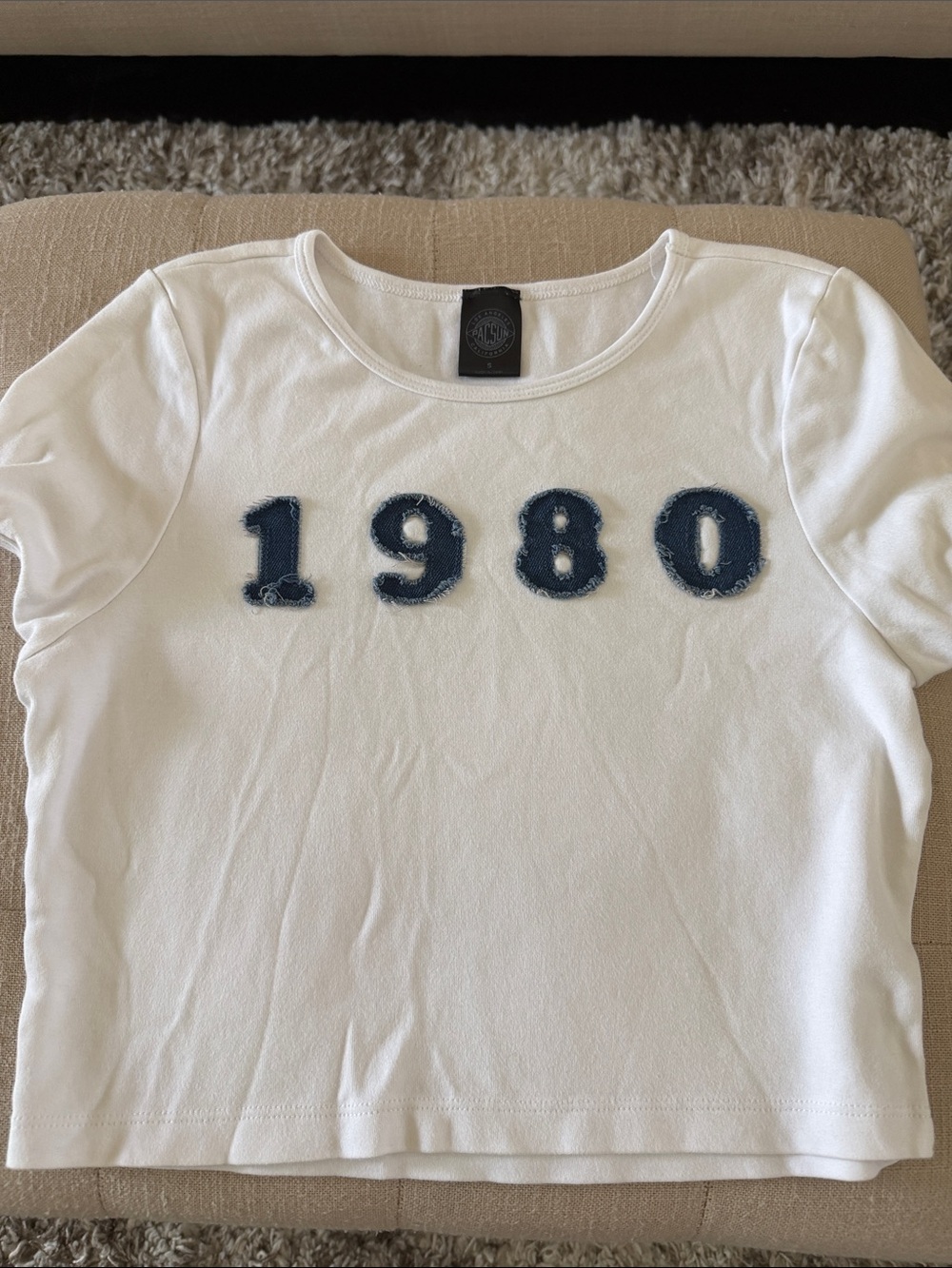 NEW NEVER WORN. Womenโs White Short-Sleeve Tee with Navy '1980' Applique